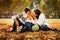 Picture of lovely family in autumn park, young parents with nice adorable kids playing outdoors, five cheerful person have fun on