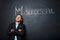 Picture of man over blackboard with crown and text successful