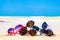 Picture many sunglasses lying on tropical beach