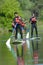 Picture men in stand up paddle boards