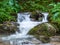 Picture of a mountain stream or creek flowing between rocks in Carpathian Mountains, Romania. Seven ladders canyon in Piatra Mare