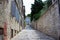 Picture of a narrow colorful stone street in the old town of Pula, Croatia, with steps at the background