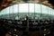 A picture of newlyweds standing in the front of a great cityscape in a panoramic restaurant