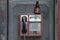Picture of a phone booth in the Serbian capital with a beer bottle left on the top of it, after a night of heavy binge drinking