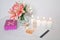 Picture of a pink luxury gift box with a bouquet of beautiful Alstroemeria flowers, a romantic candle, perfume and a credit card.