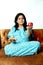 Picture of pregnant lady is holding medicine and apple in hand with smile face