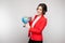 Picture of pretty woman in red blazer with earth sphere in hands