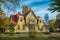 Picture of red wooden scandinavian style house at the lake during autumn