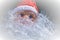 A picture of a Santa Cos figurine decorated with photo-editing techniques for use in cards or graphics.