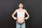 Picture of shocked or surprised pregnant lady standing over colored background. Looking at camera