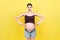 Picture of shocked or surprised pregnant lady standing over colored background. Looking at camera