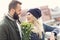 Picture showing young couple with flowers dating in the city