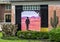 Picture of a solitary cowboy walking in the desert surrounded by cactus sculptures on the outside of a business in Dallas, Texas.