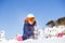 Picture of sports woman sitting in snowdrift, snow-throwing