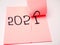 Picture of sticky note with 2020 number which symbolizes end of year 2020