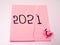 Picture of sticky note with 2020 number which symbolizes end of year 2020