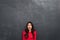 Picture of surprised brunette woman in red blouse