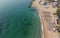 The picture taken from the height. a beach with lots of umbrellas. Waiting for tourists on the seashore