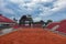 Picture of tennis court with red ground and beautiful cloudy sky