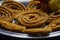 Picture of traditional festival snacks of India Chakali, Popular homemade salty and spicy snacks