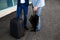 Picture of two businessmen with umbrella and suitcase at station background