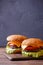 Picture of two hamburgers on wooden table