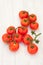 Picture of vine tomatoes on a white wooden background