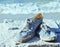 picture of vintage old shabby sneakers at seacost, real forgotten shoes