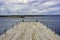 Picture of wooden pier with beatiful blue sky at the background