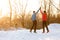 Picture of young sportsmen doing handshake in winter park at afternoon