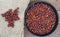 Pictures of rosehip fruit dried in a tray, drying rosehip, drying rosehip to drink rosehip tea.