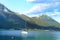 picturesque Achensee lake in Austria, yachts and boats on water, green mountains rises above calm expanse of water, concept of