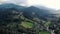 Picturesque aerial view of the mountain landscape, forests, meadows and small villages.