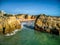 Picturesque aerial view of a serene beachside town in Portimao, featuring a large body of water