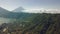 Picturesque aerial view of tropical rural side with forest, beach and mountains