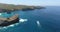 Picturesque aerial view of turquoise water of Bali Island, Indonesia. White Cruise ship moving fast Leaving a wake behind