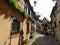 Picturesque alleys of Eguisheim, tipical old houses decorated with flowers., France