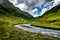 Picturesque Alpine Landscape With Old Farmhouse, River And Browsing Cattle In Deferegental In Tirol In Austria