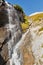 Picturesque Alpine waterfall, Grossglockner High Alpine Road in Austrian Alps.