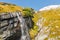 Picturesque Alpine waterfall, Grossglockner High Alpine Road in Austrian Alps.