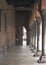 The picturesque ancient medieval street with columns in Ferrara