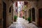 Picturesque arch with a colorful street at the background in the old town of Rovinj, Croatia