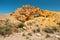 Picturesque arch in the red rock in the desert canyon