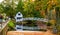 Picturesque arched white wooden foot bridge