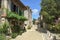 Picturesque architecture and early summer sunshine brings a few visitors to Pujols, Lot-et-Garonne, France