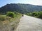 A picturesque asphalt road among low mountains.