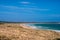 Picturesque Australian seascape beach with people surfing