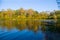 Picturesque autumn landscape of river and bright trees and bushes