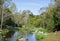 Picturesque autumn landscape of steady river and bright trees