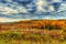 Picturesque autumn landscape. View from the hill to the lowland